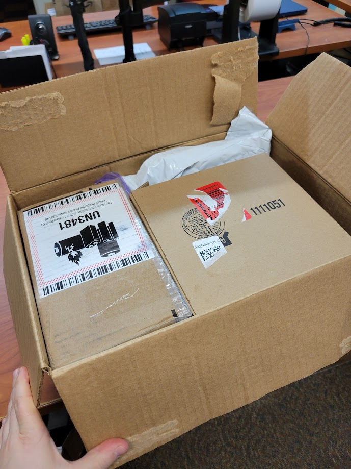 An example of a well-packed box with smaller cardboard boxes placed inside to fill an otherwise too large space.